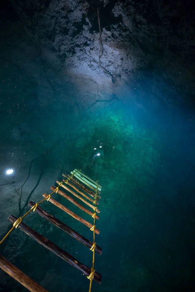 The ladder down into the cenote before the rappel