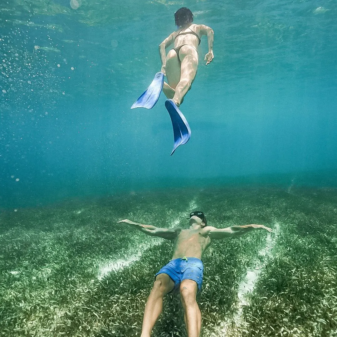 Floating on the turquoise water of an open cenote