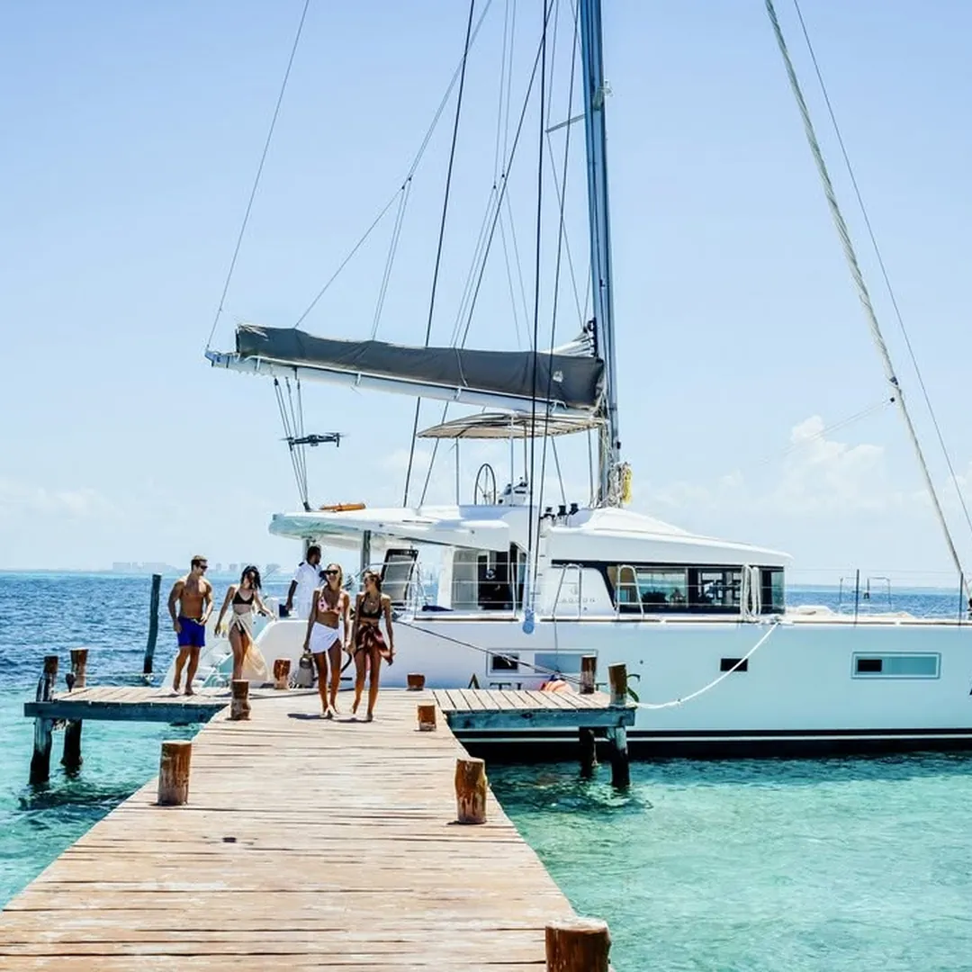 A catamaran moored at a wooden pier