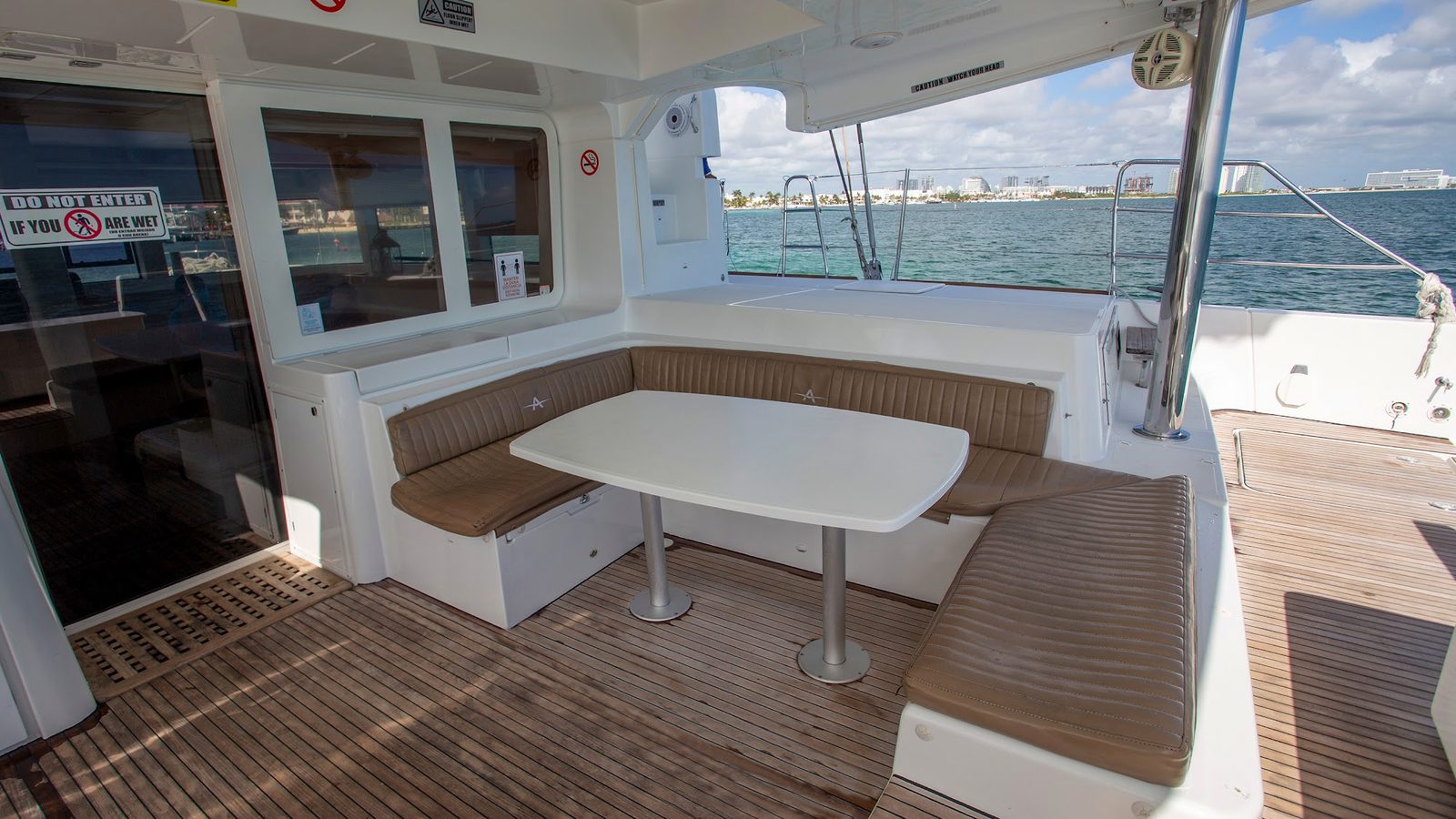 The outdoor dining table under the cockpit roof