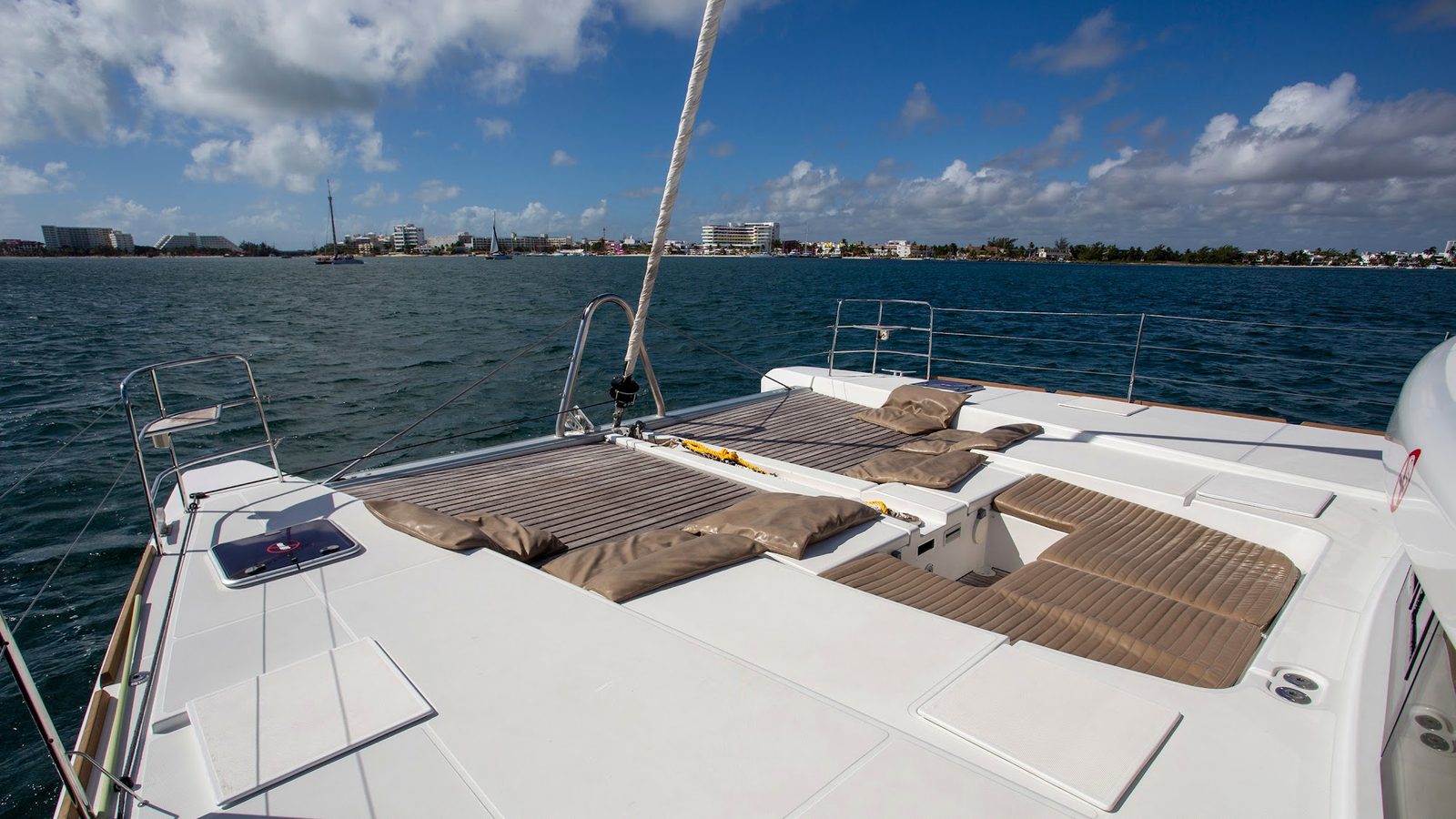 The bow lounge with cushions facing the water