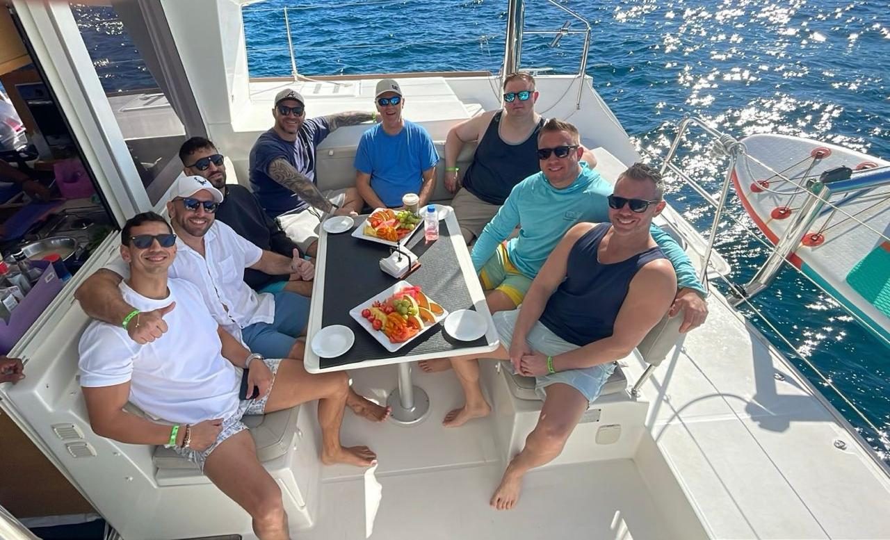 Guests sharing the onboard menu at the cockpit table