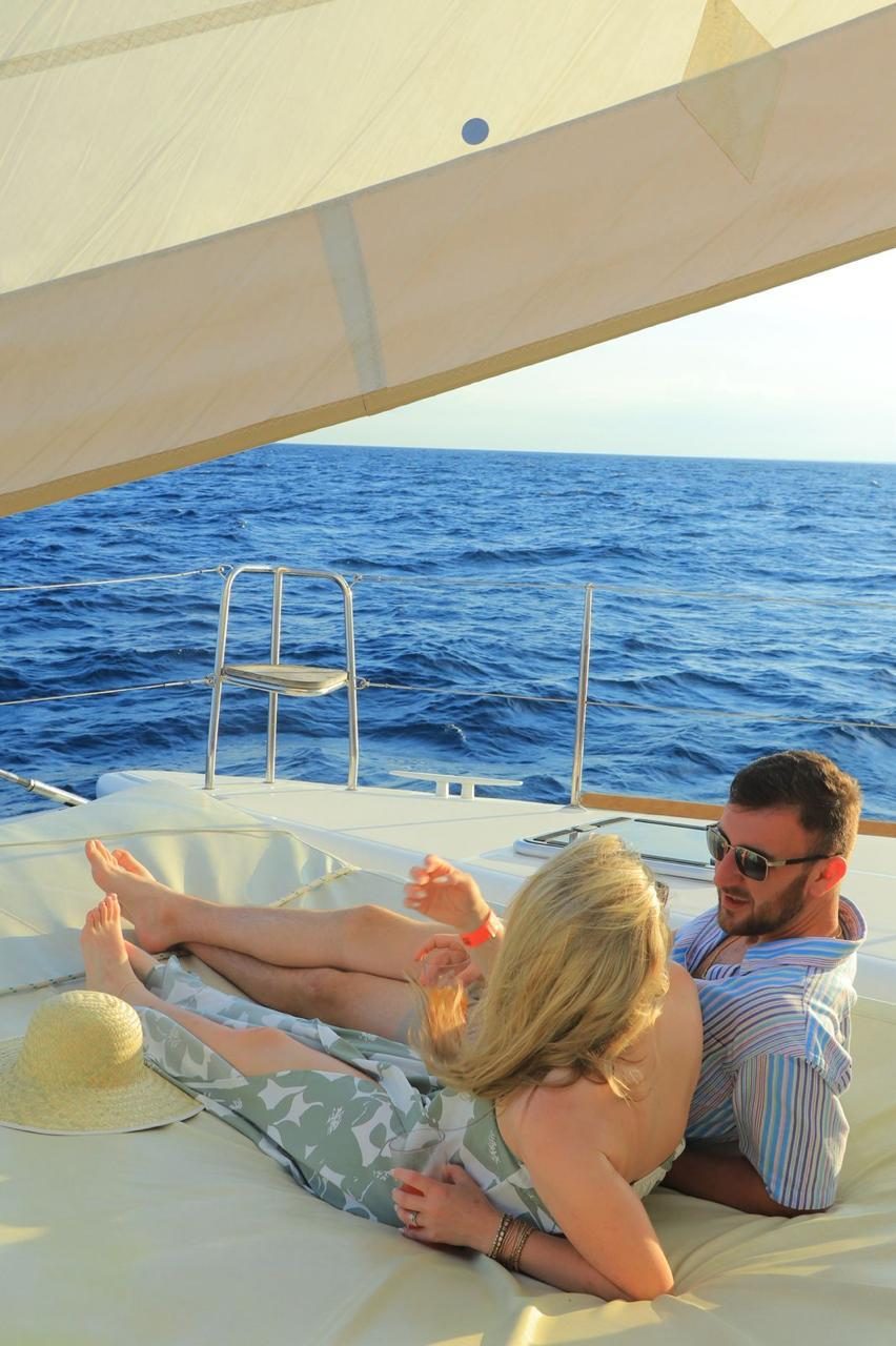 A couple relaxing on the bow net