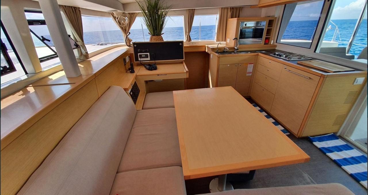 The catamaran's shaded salon and galley
