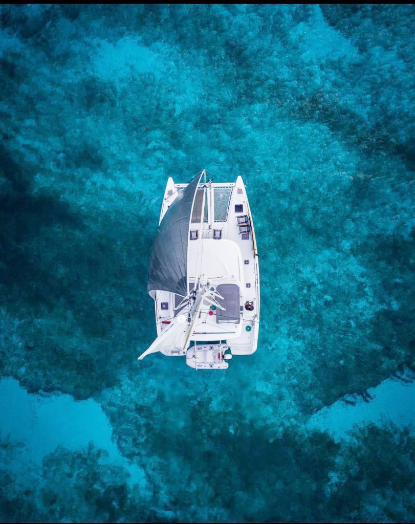 Aerial view of the catamaran over the reef
