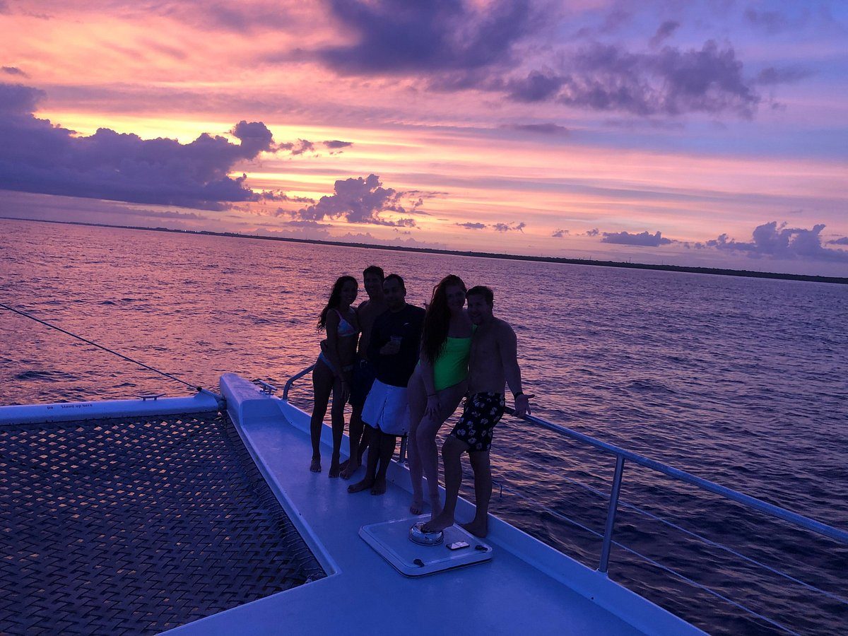 Friends on the bow at sunset