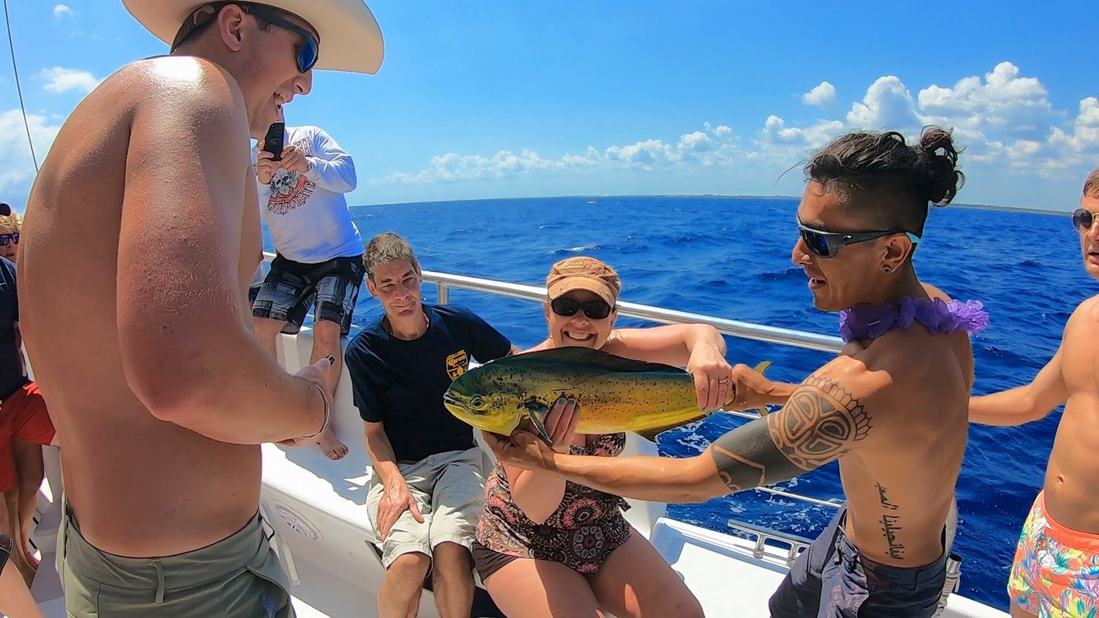 Guests showing a fish caught on the trolling line