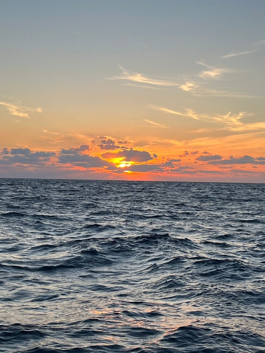 Sunrise over open water on the way out