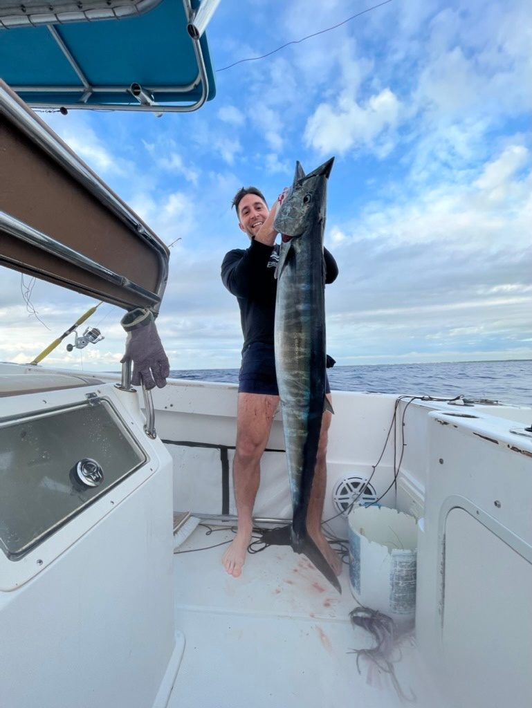 A wahoo held up on deck