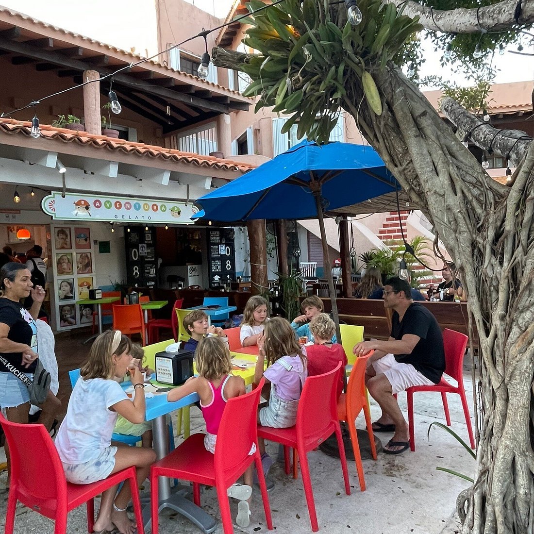 A café terrace where the village stops for breakfast