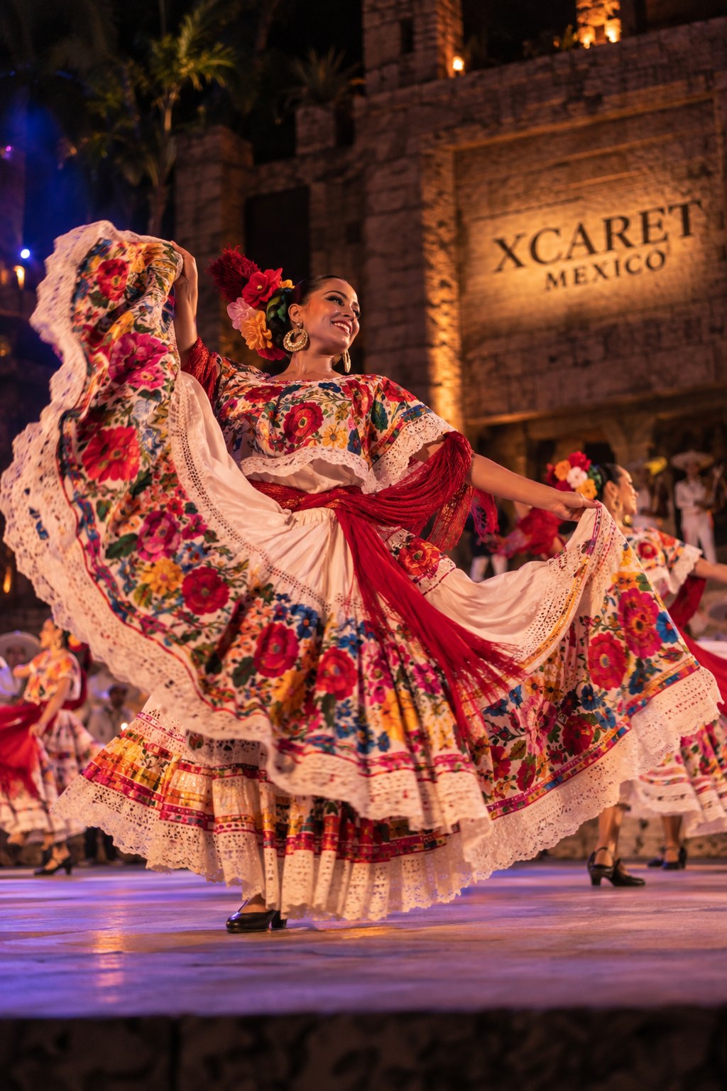 Folk dancers spinning in embroidered skirts