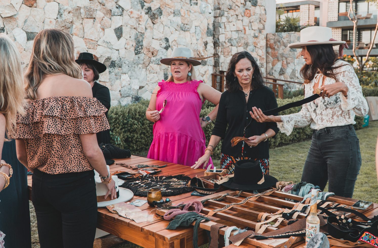 Guests choosing bands and details for their hats