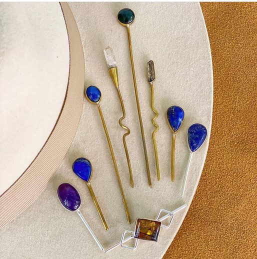 Pins with stones on a hat brim