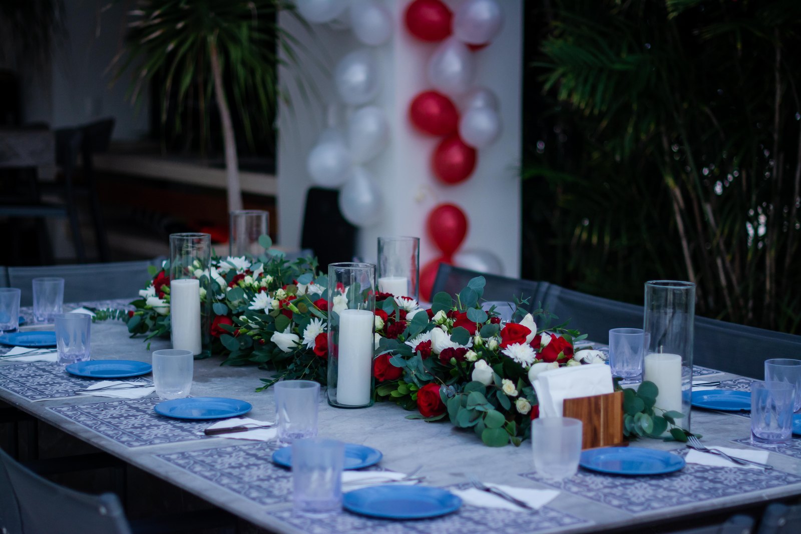 A table dressed for a celebration with flowers and candles