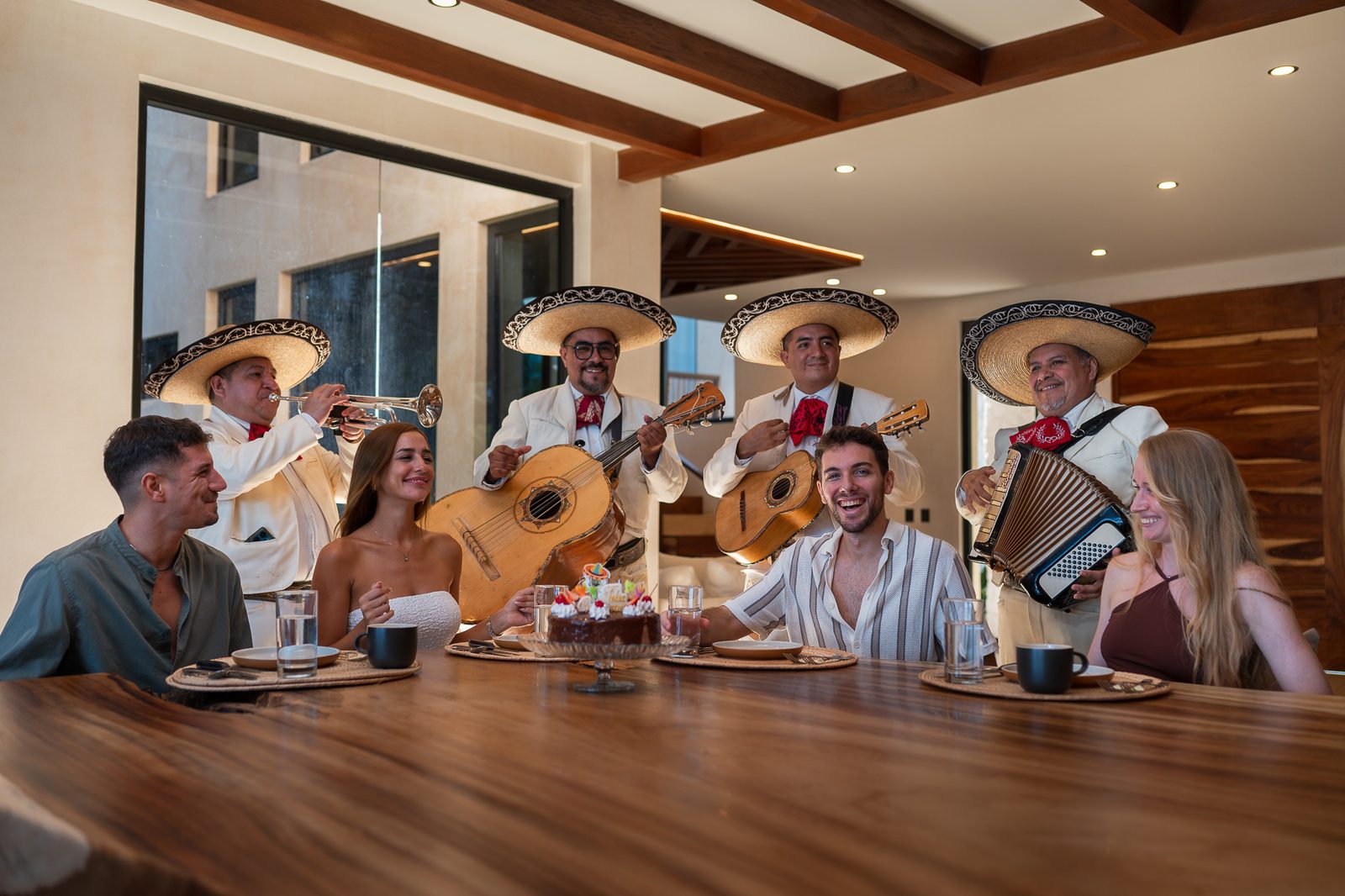 A mariachi serenade at the dining table of the villa