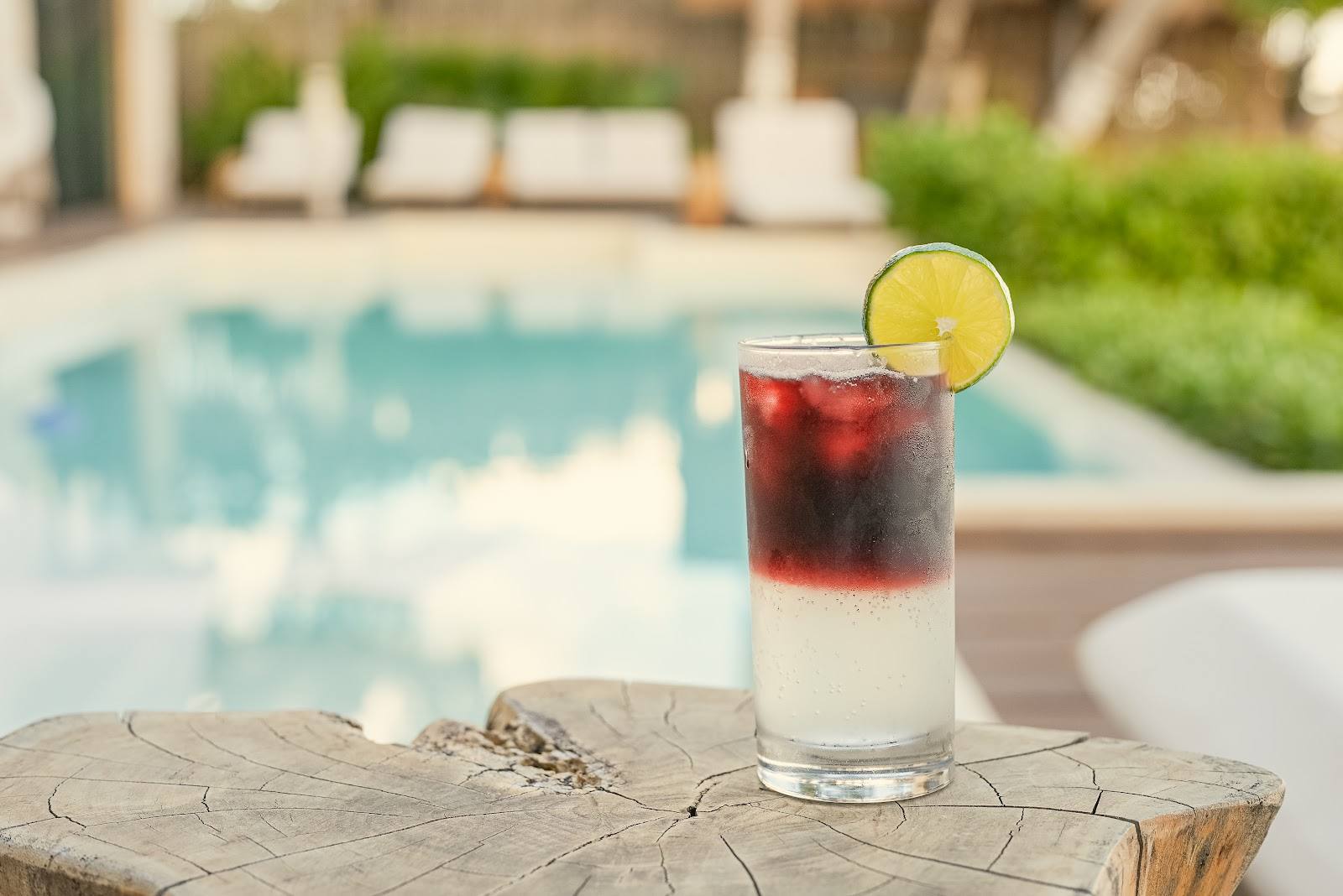 A bartender preparing cocktails at a villa bar