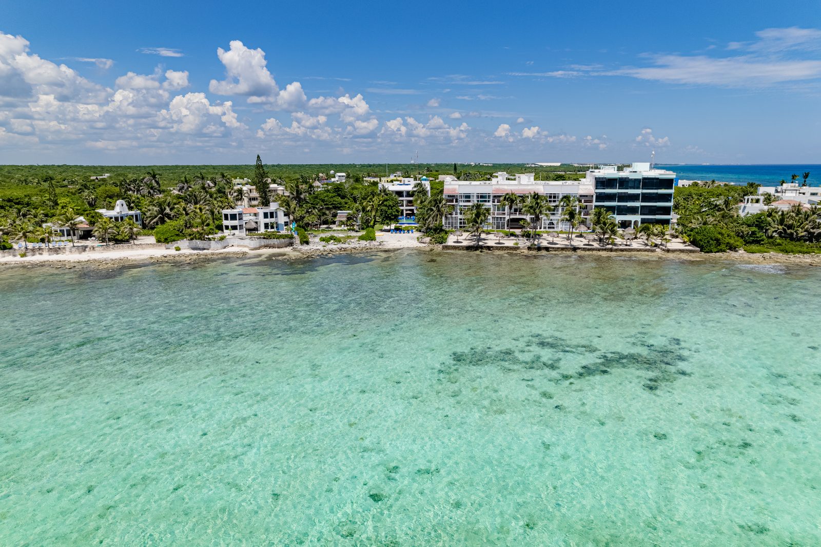 Aerial view of the beachfront on Half Moon Bay and its turquoise water