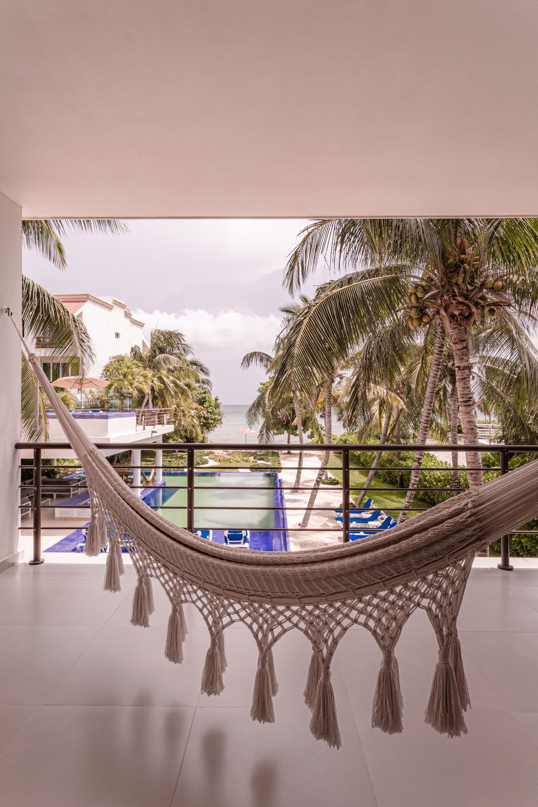 Balcony hammock looking over the pool to the sea