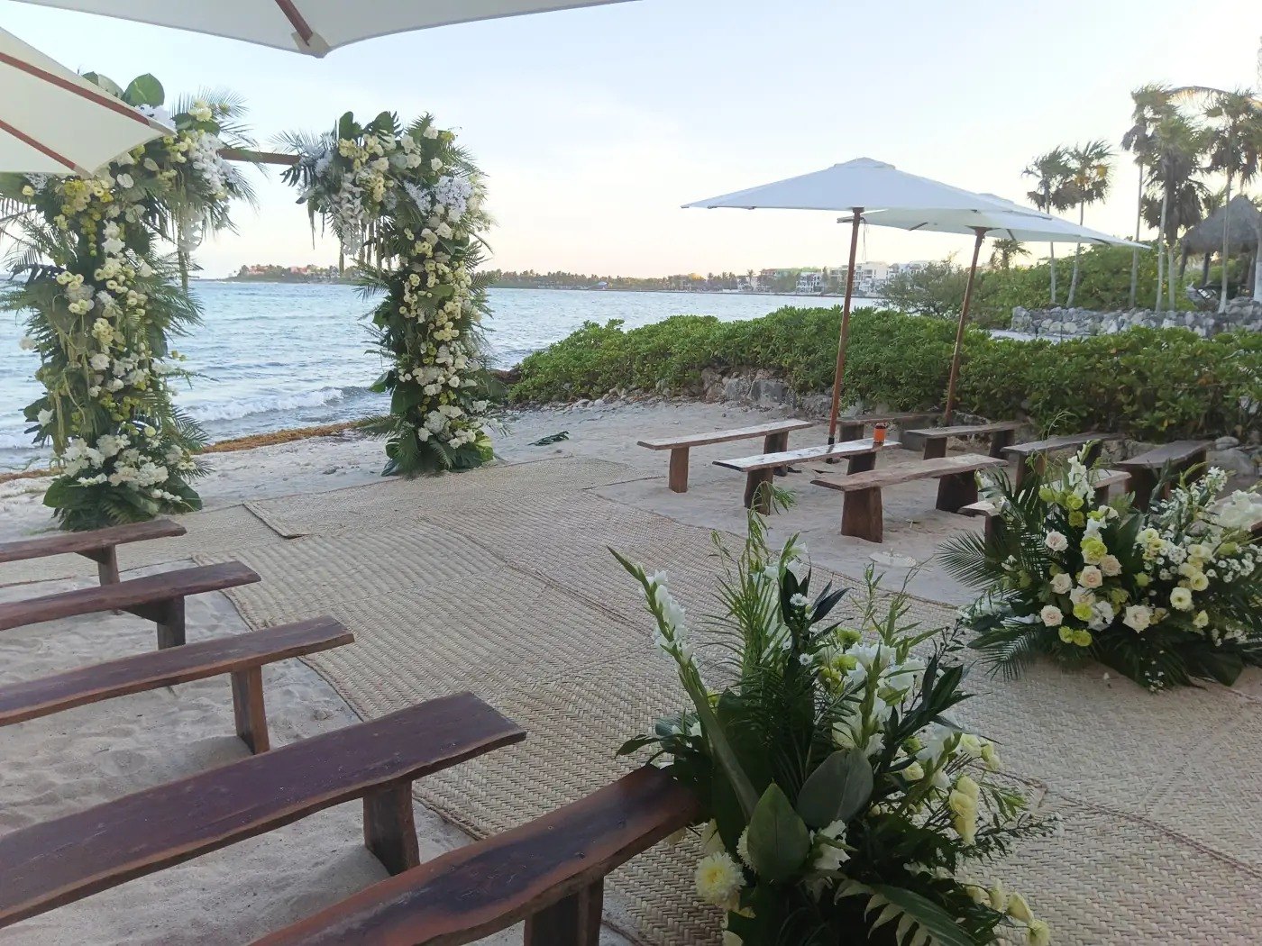 Long tables facing the sea, set for an event
