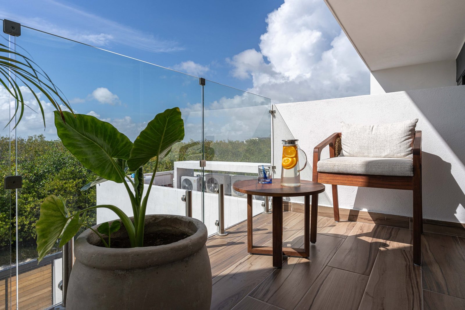 Balcony with an armchair among the trees