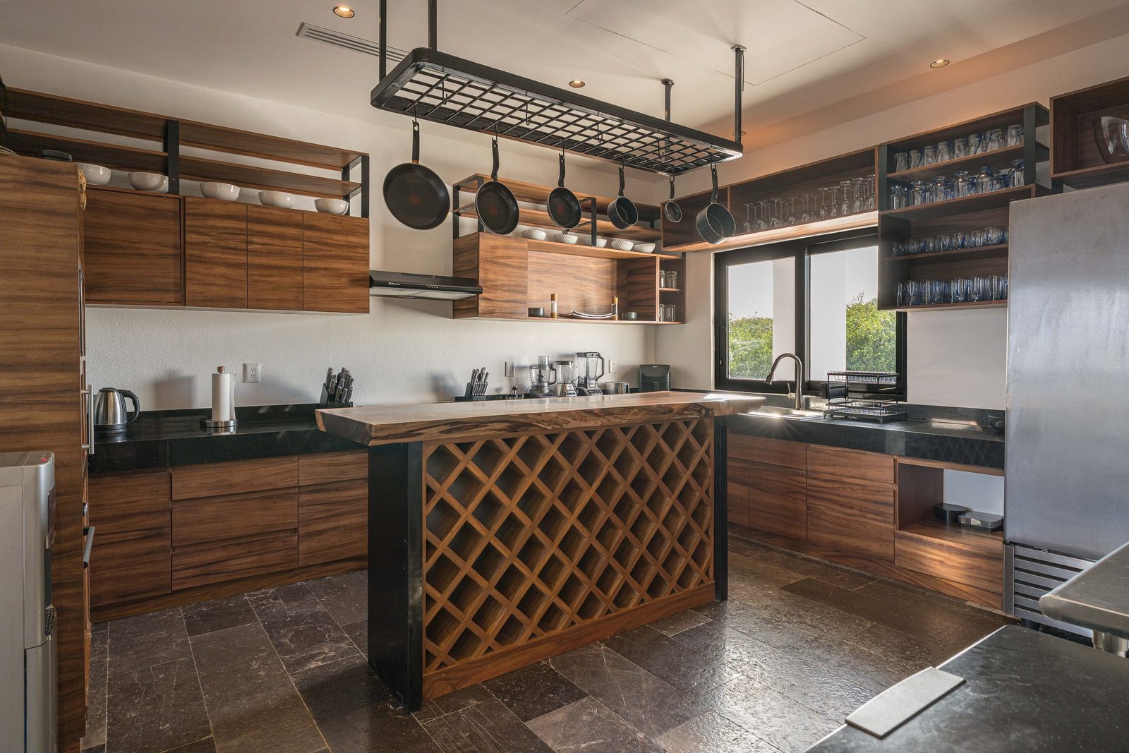 Kitchen with wood cabinetry and a central island