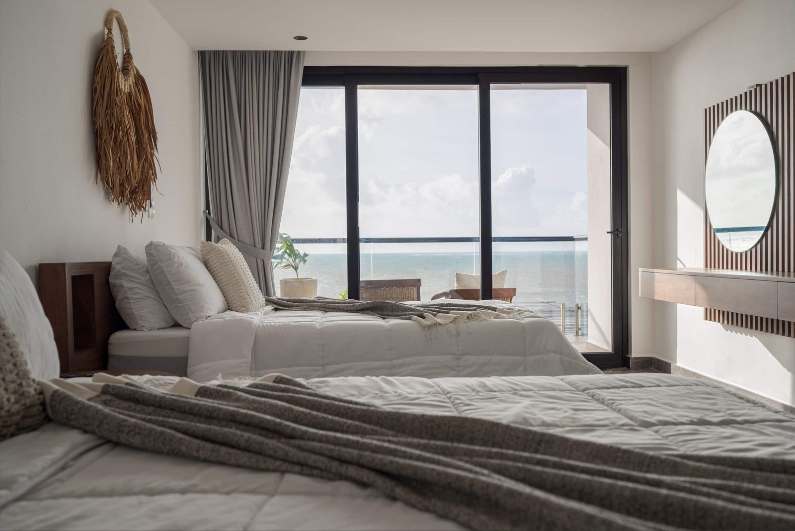 Bedroom with sliding doors to a sea-view balcony