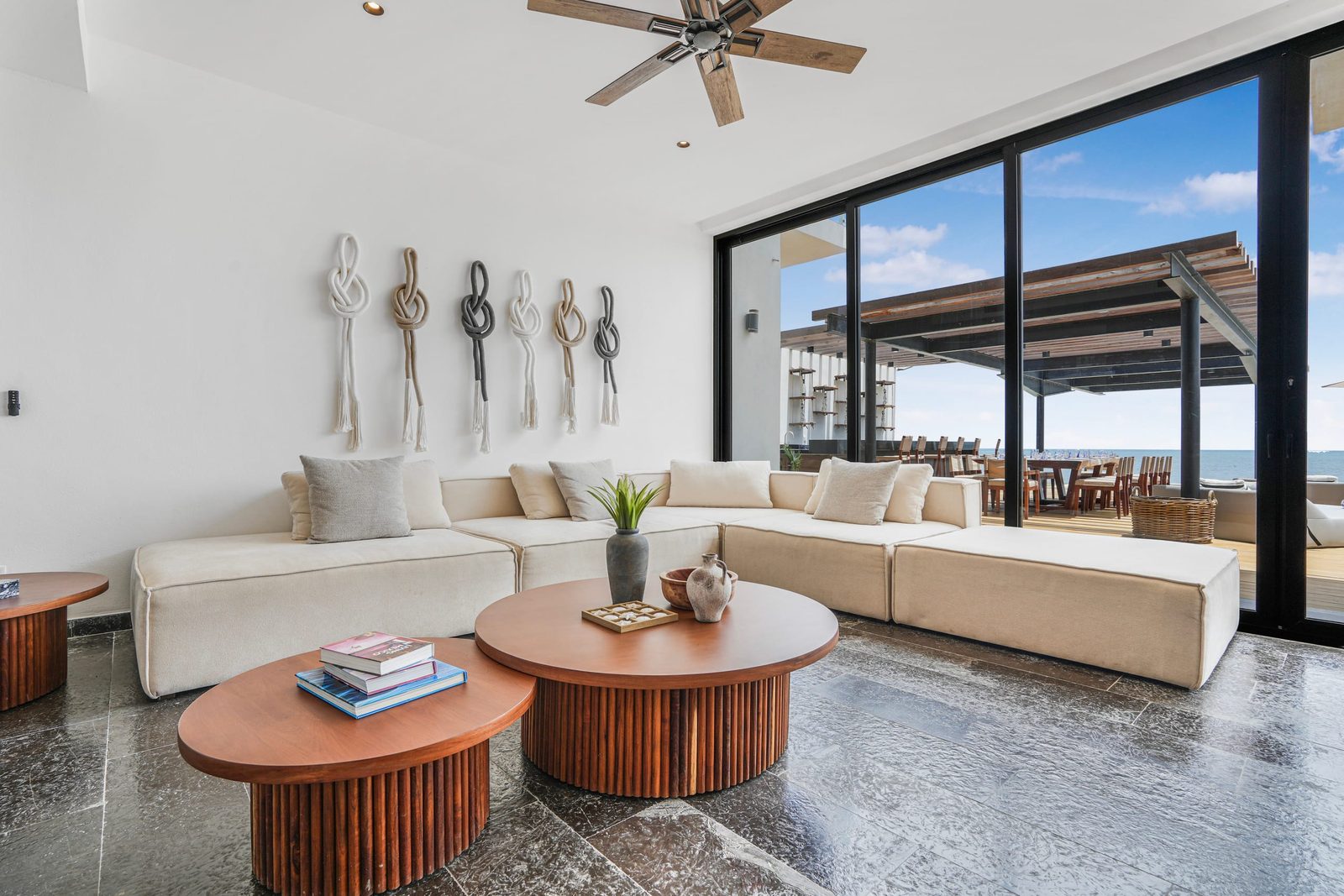 Living room with sofas and windows to the terrace