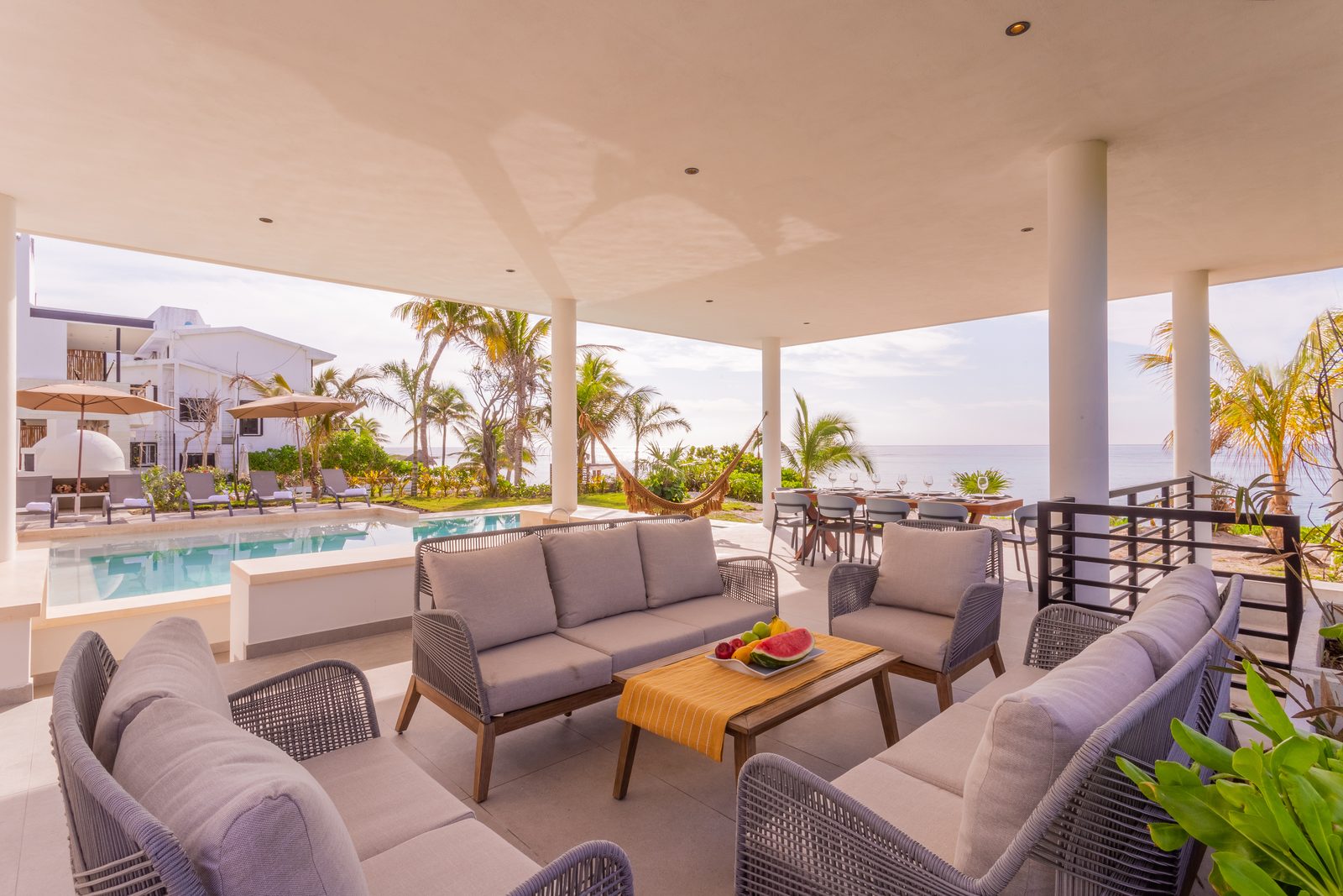 Terrace lounge overlooking the pool and the sea
