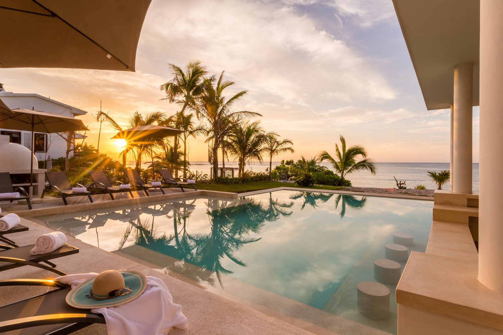 The pool at sunrise with the Caribbean behind