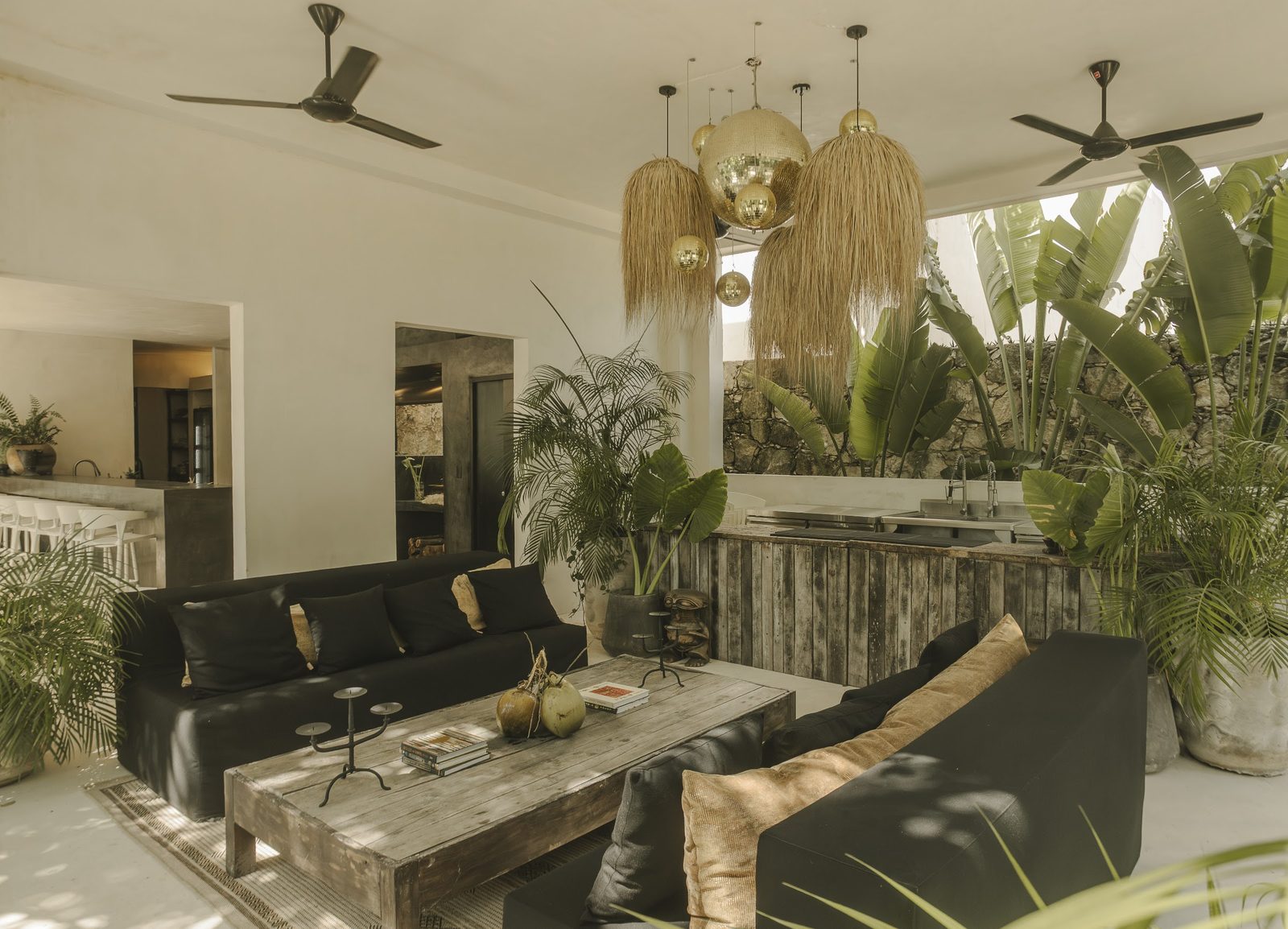 The open living room with woven pendant lamps