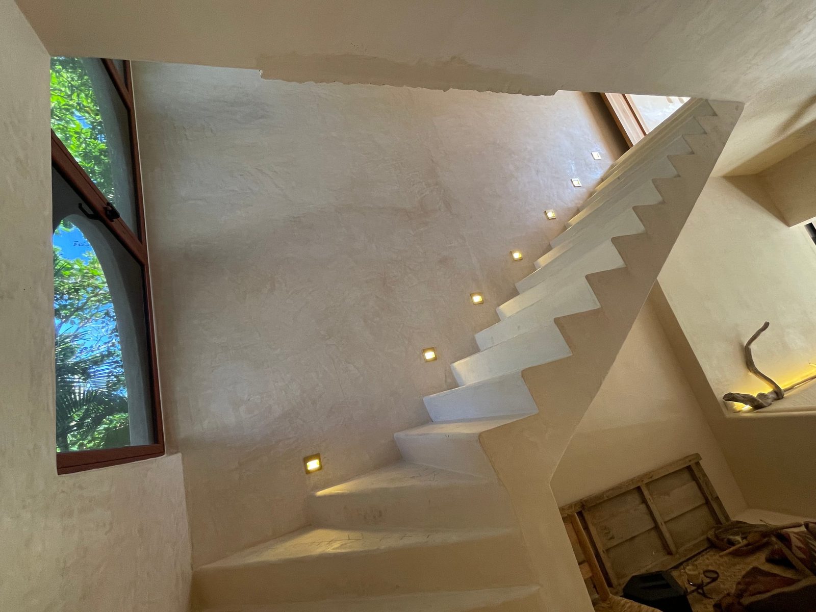 The sculpted staircase to the upper floor