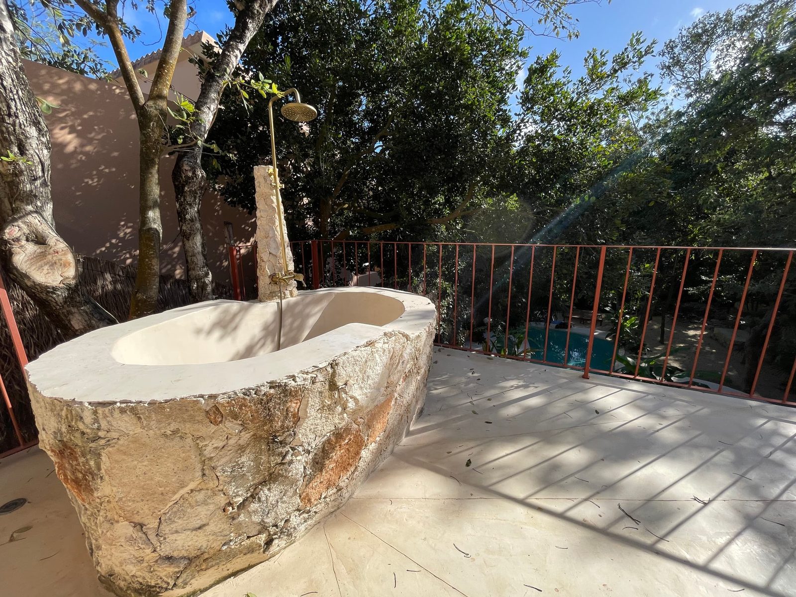 A carved stone tub on the rooftop terrace