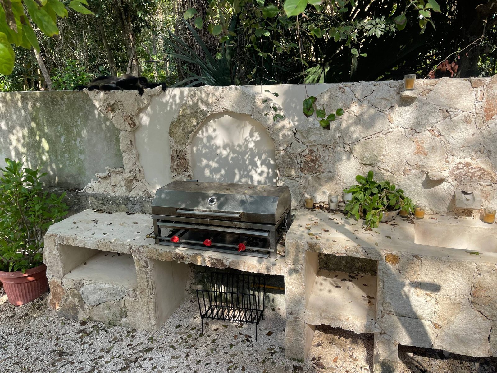 The outdoor stone grill in the garden