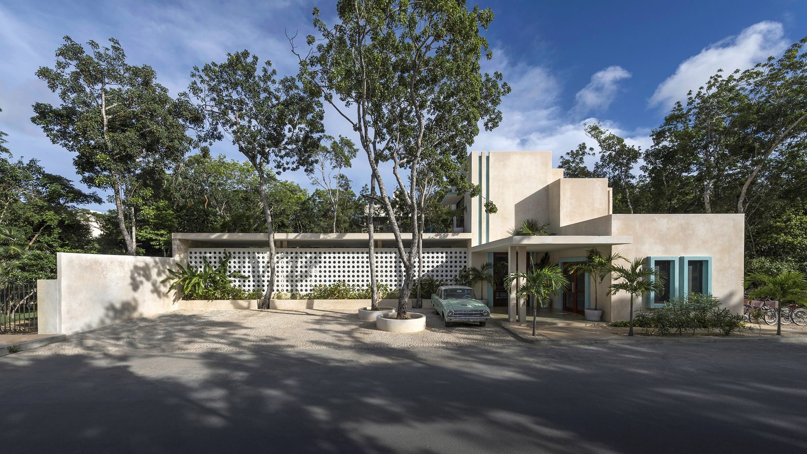 The villa’s mid-century facade among the trees of La Veleta