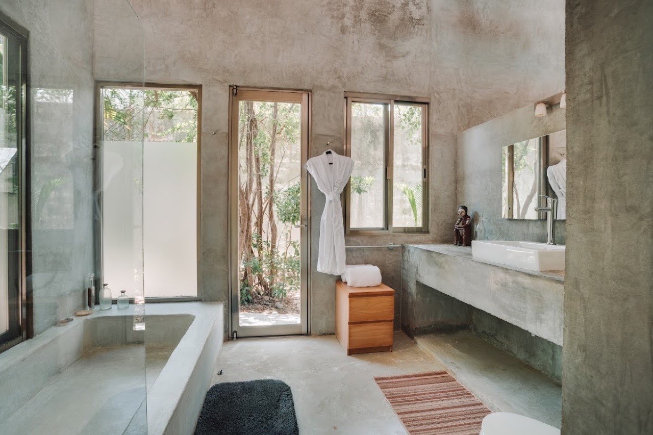 A bathroom with a soaking tub and garden windows