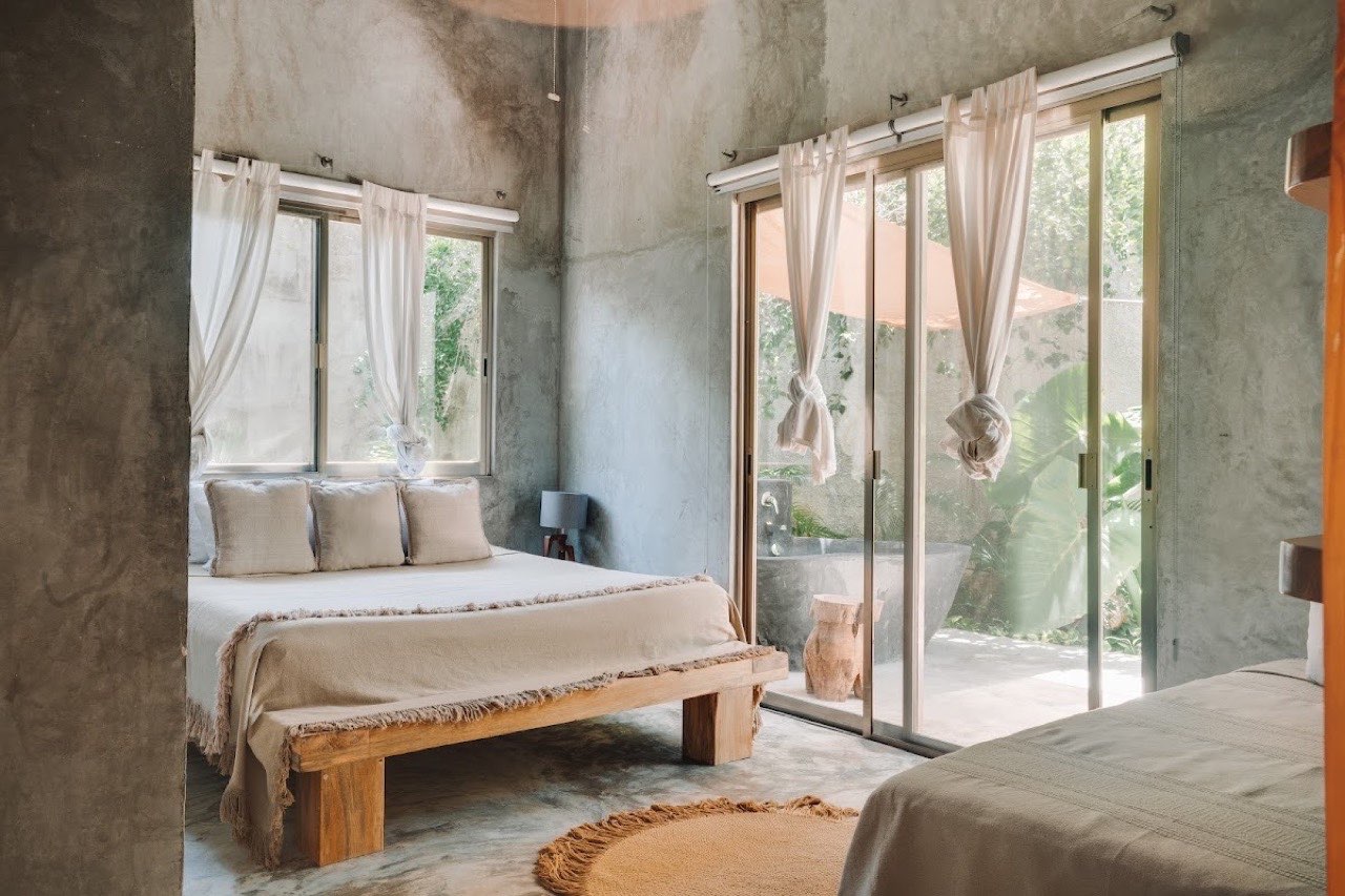 A bedroom opening onto a private patio