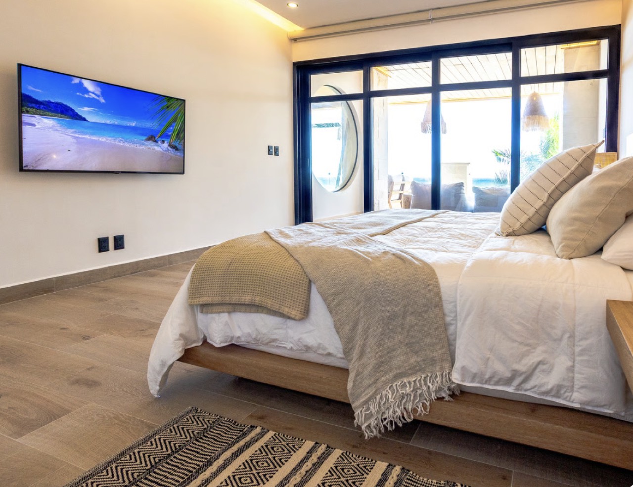 The master bedroom with glass doors to the terrace
