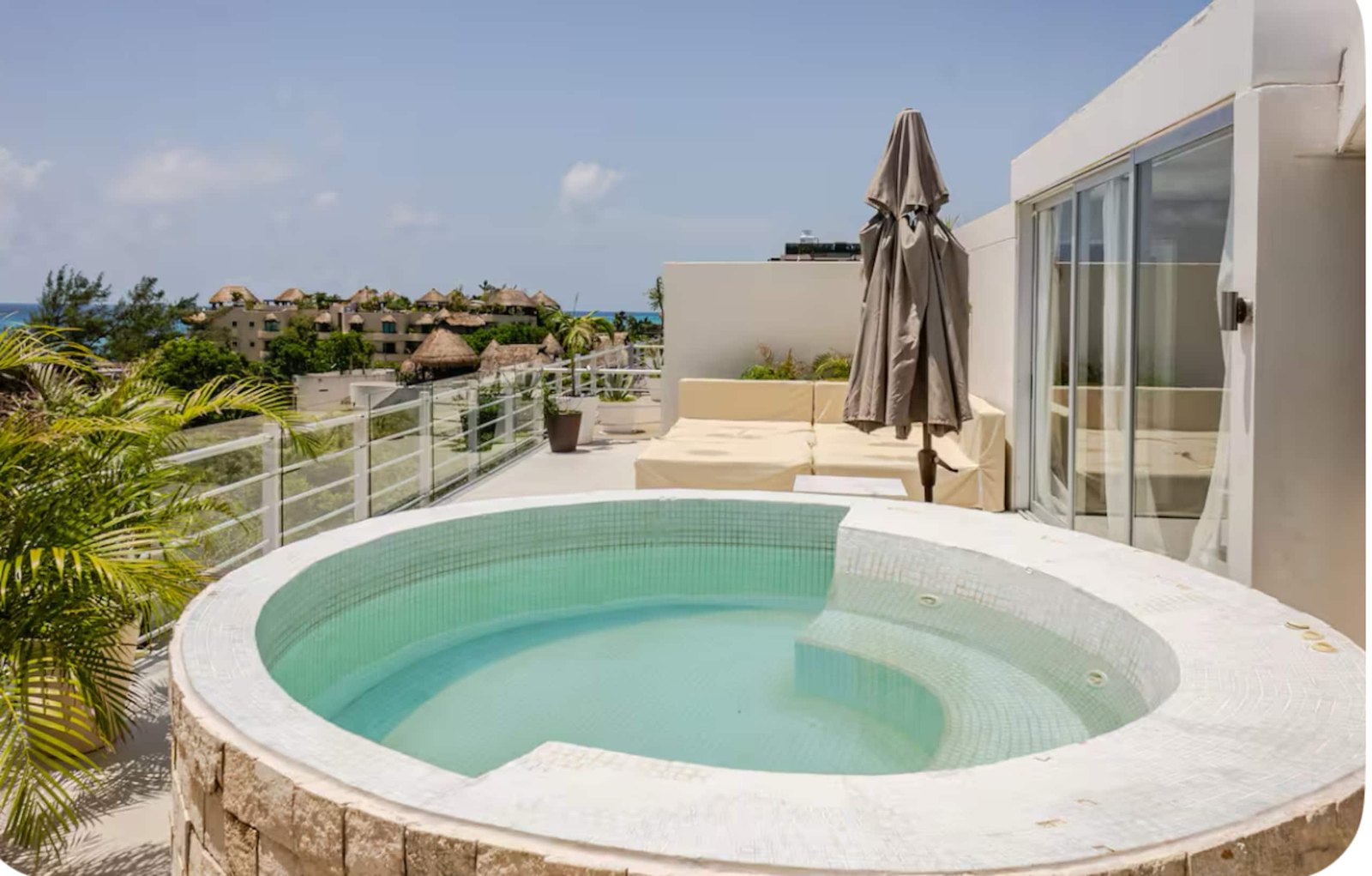 The round hot tub on the rooftop terrace