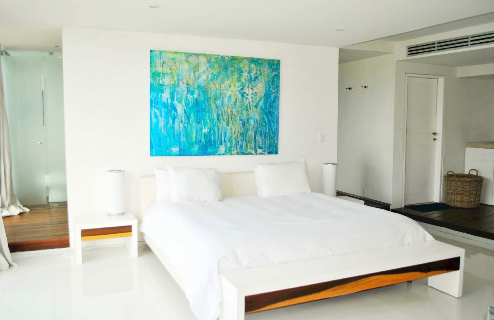 Bedroom with a king bed and art