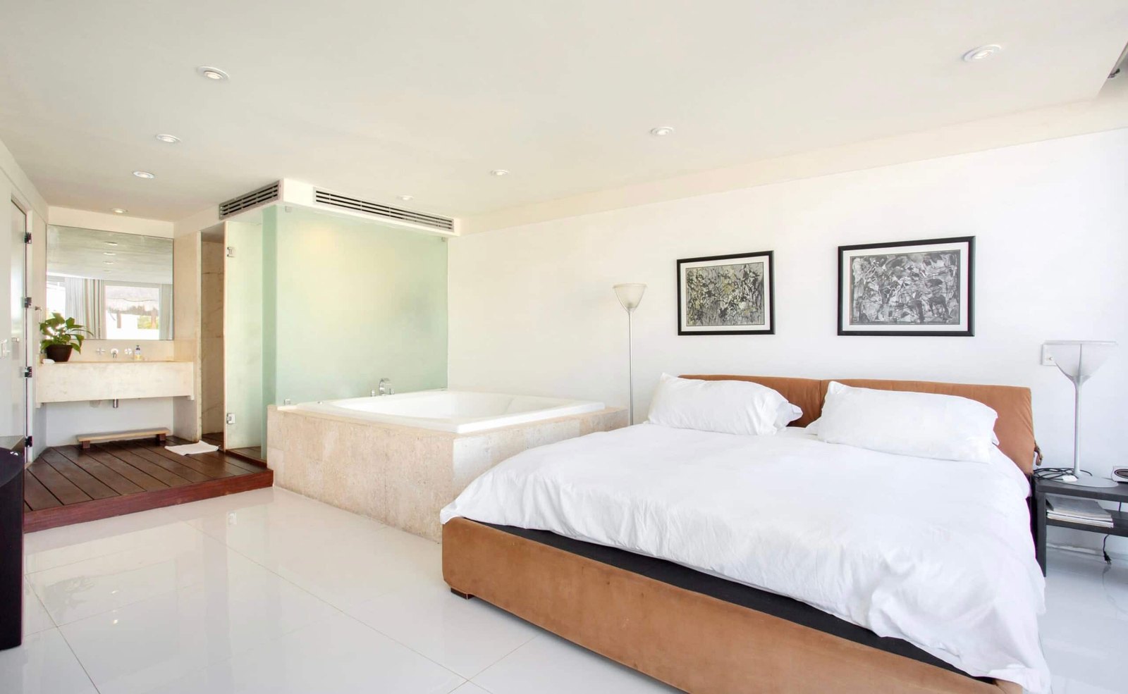 Bedroom with two beds and a desk