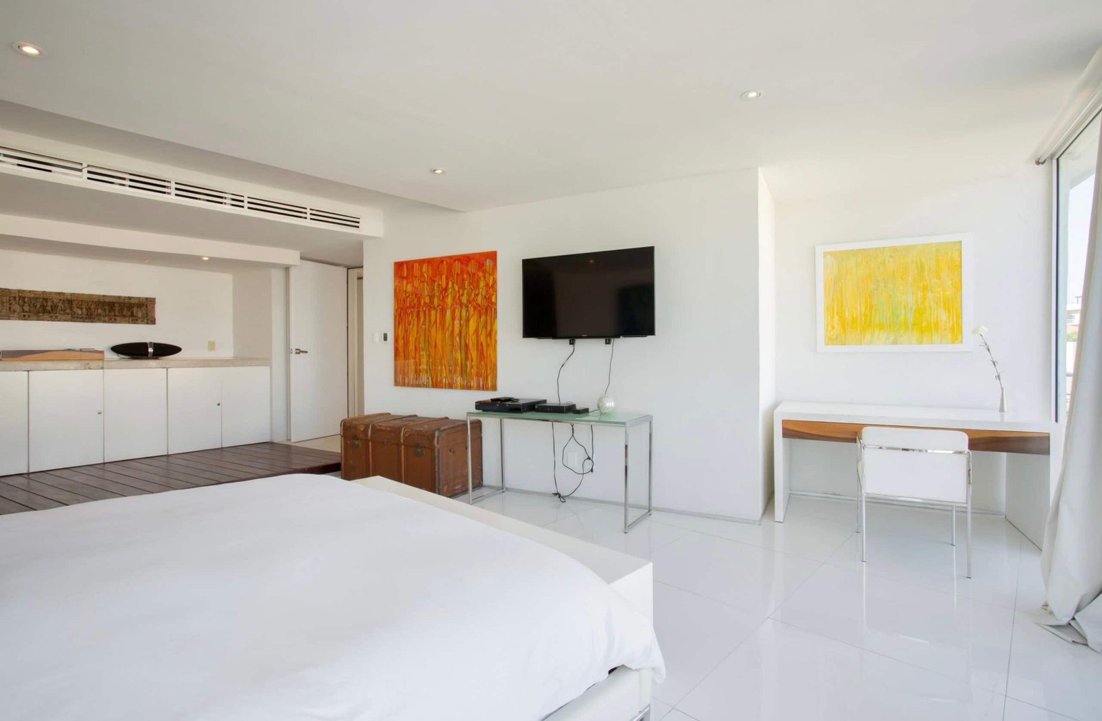 Bedroom with a jetted tub and a king bed
