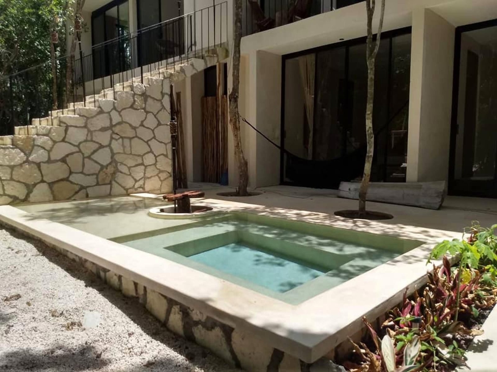 A plunge pool on the terrace of a ground-floor suite