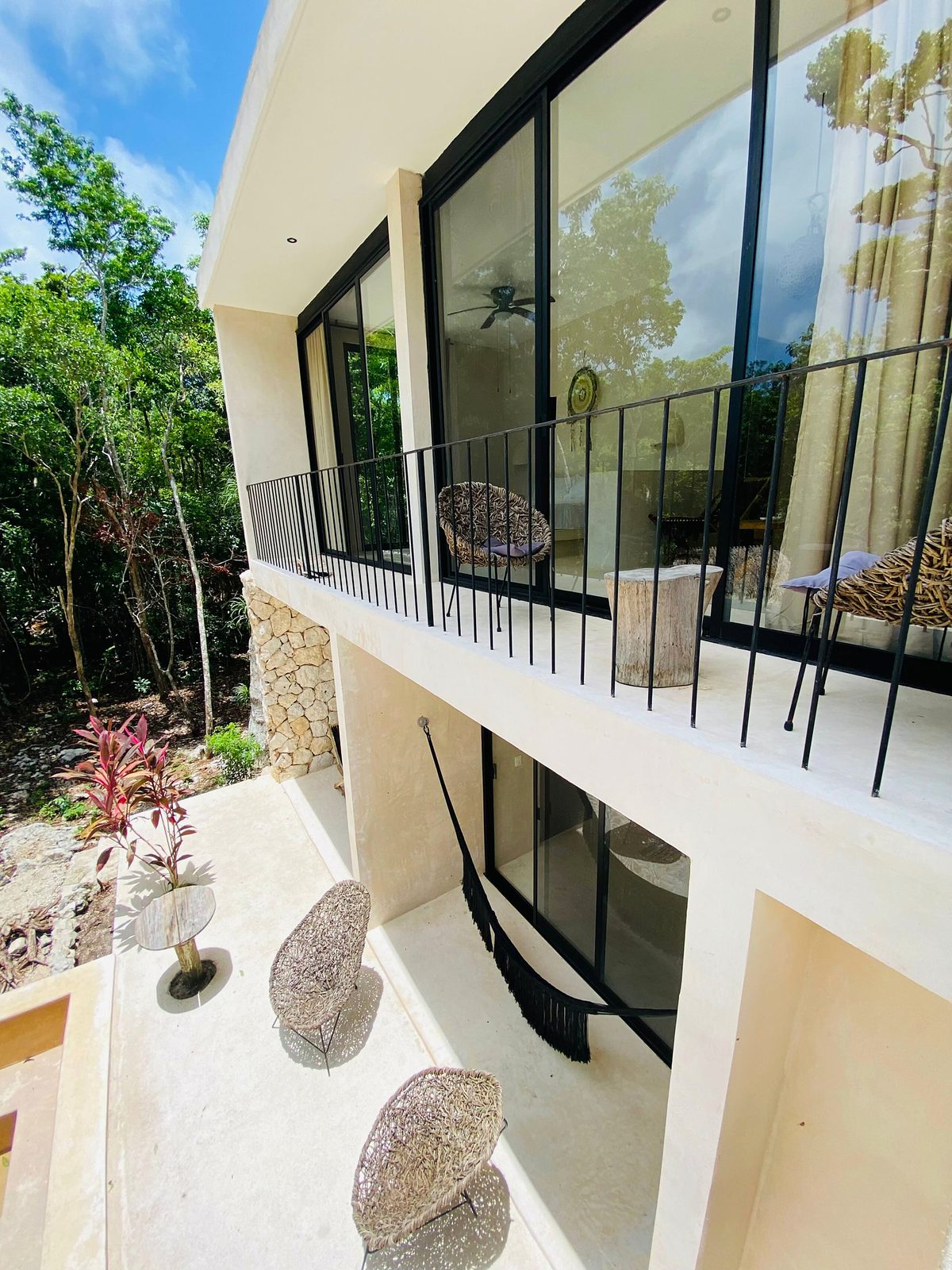 Suite balconies and a terrace hammock facing the jungle