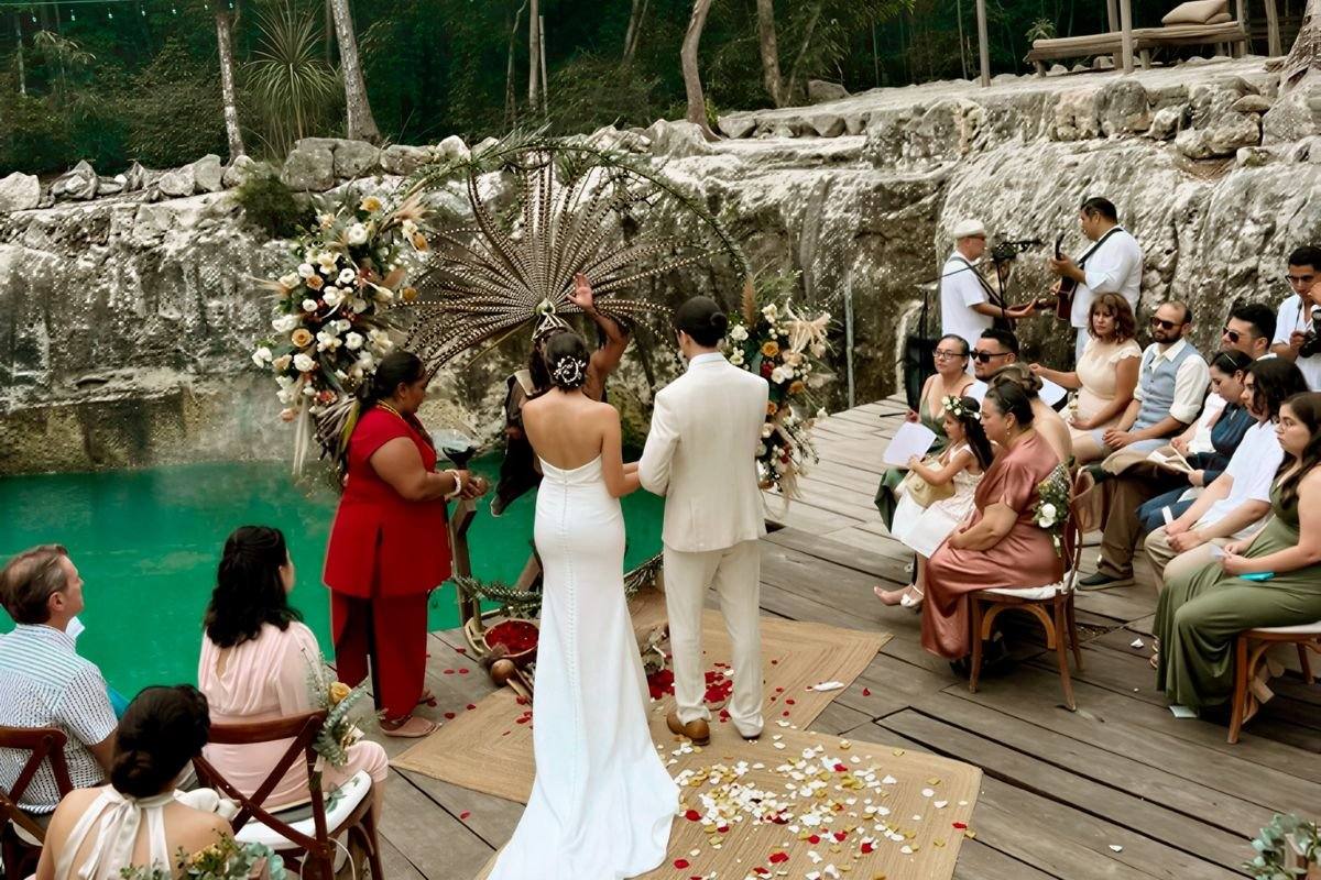 A wedding ceremony on the deck beside the cenote