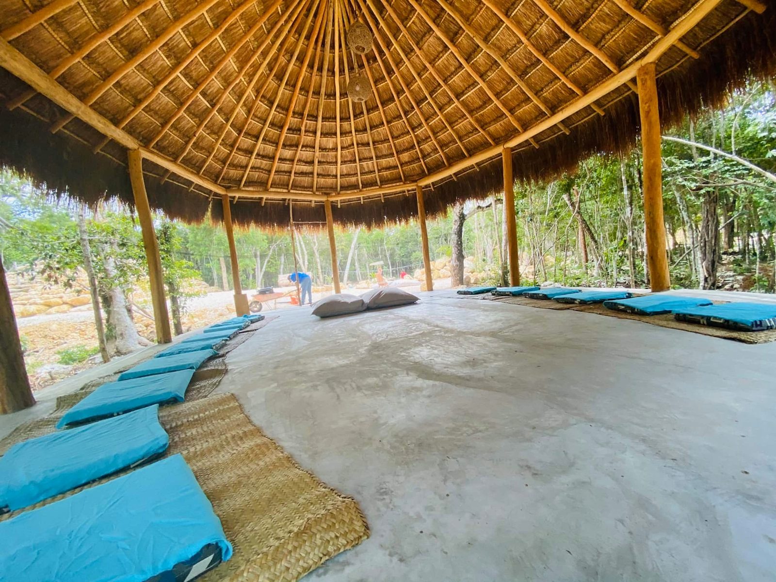 The palapa with floor cushions for yoga and gatherings