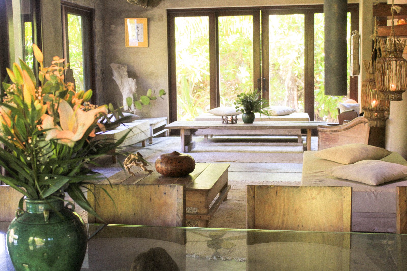 The living room with flowers, wood and natural light