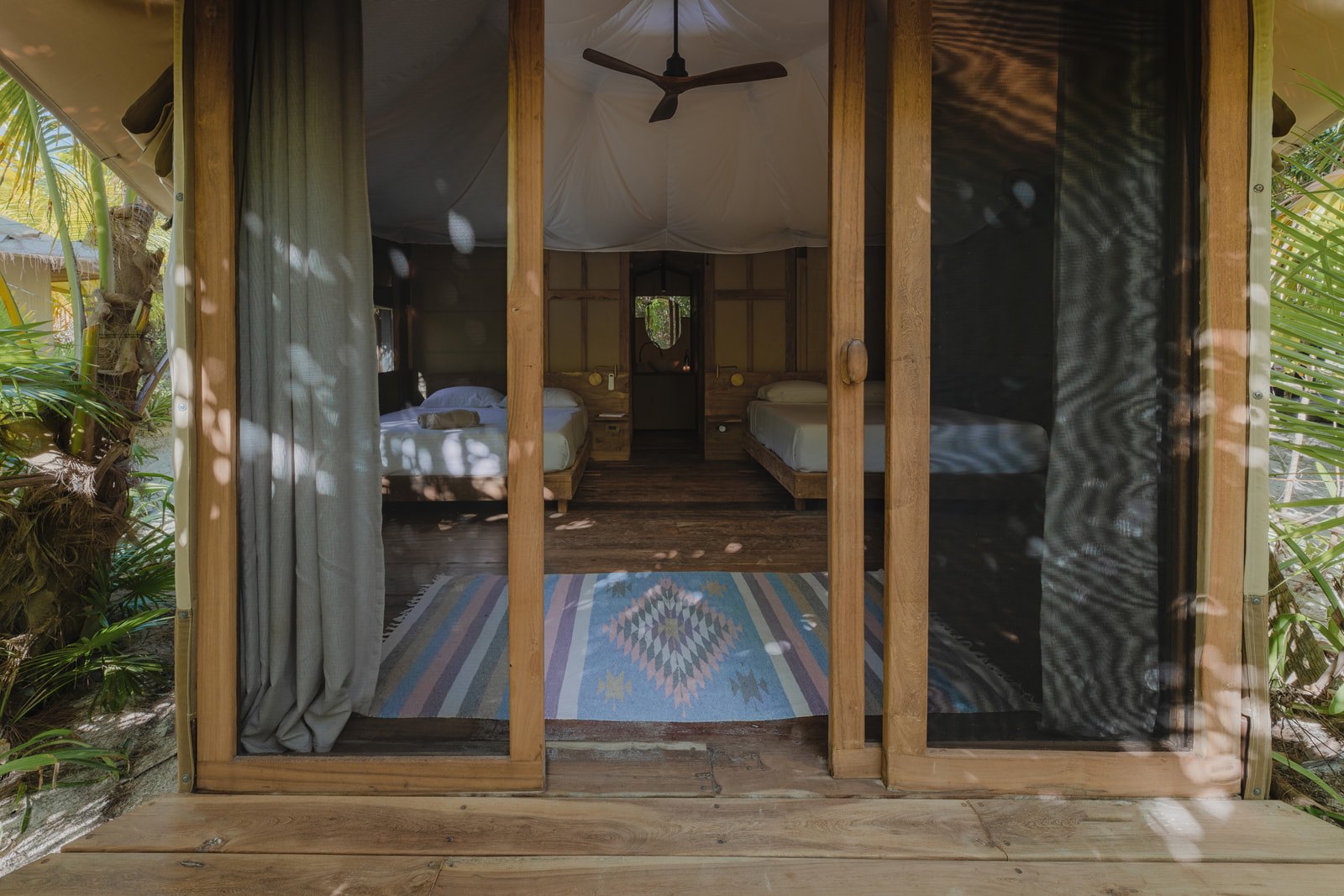 A safari tent with its own bathroom, open to the garden