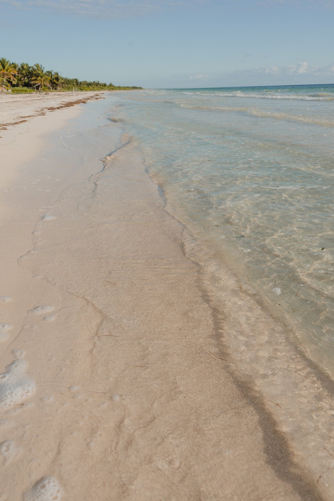 Clear, shallow water on the property's beach