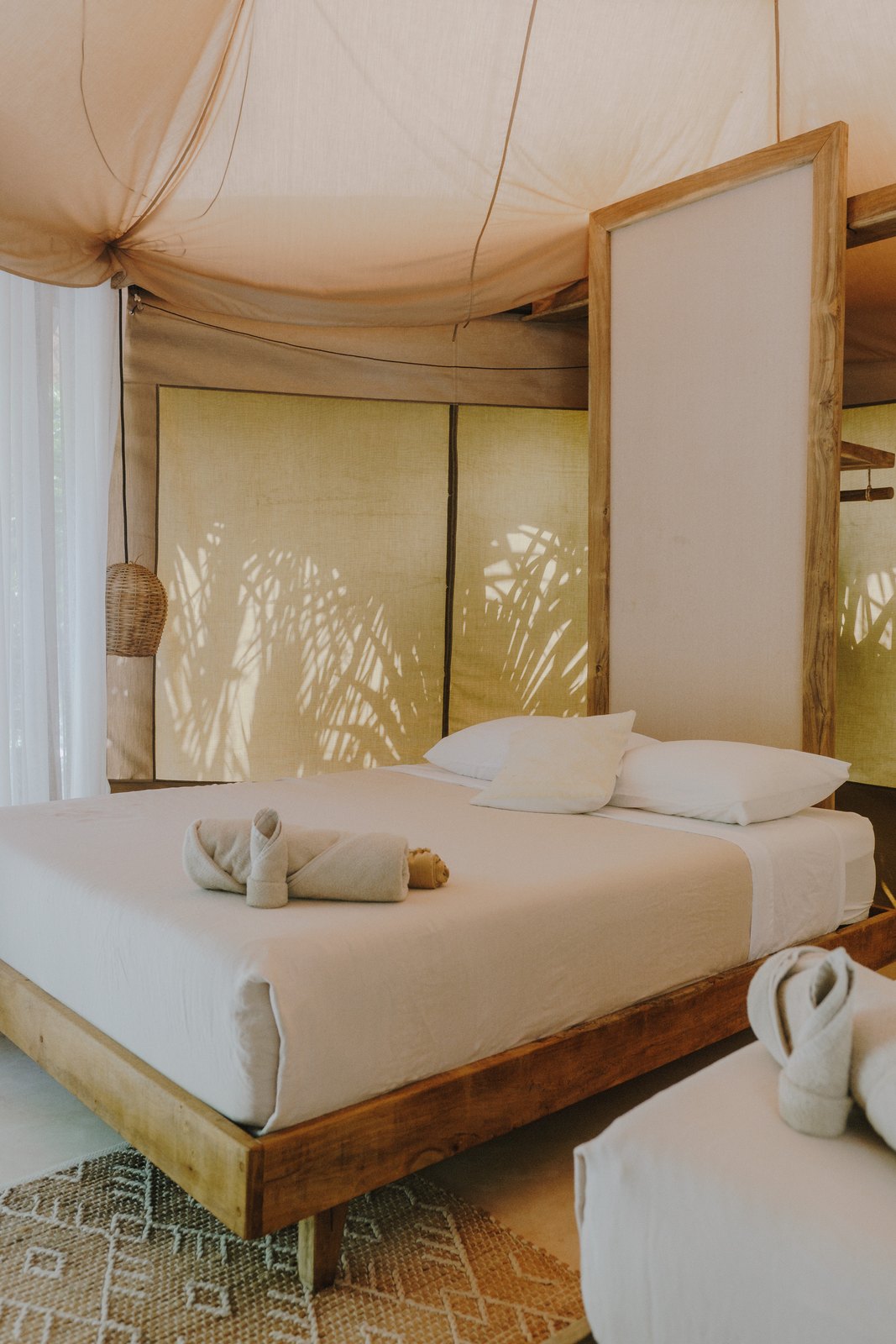 A safari tent with two queen beds