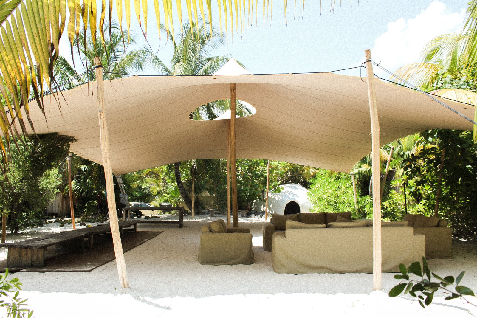 The open-air shala under a white canopy